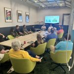 i4Series networking event attendees are seated during a panel discussion about business resiliency featuring Go Fig AI co-founder Nathan Freystraetter. The Business Resilience Playbook