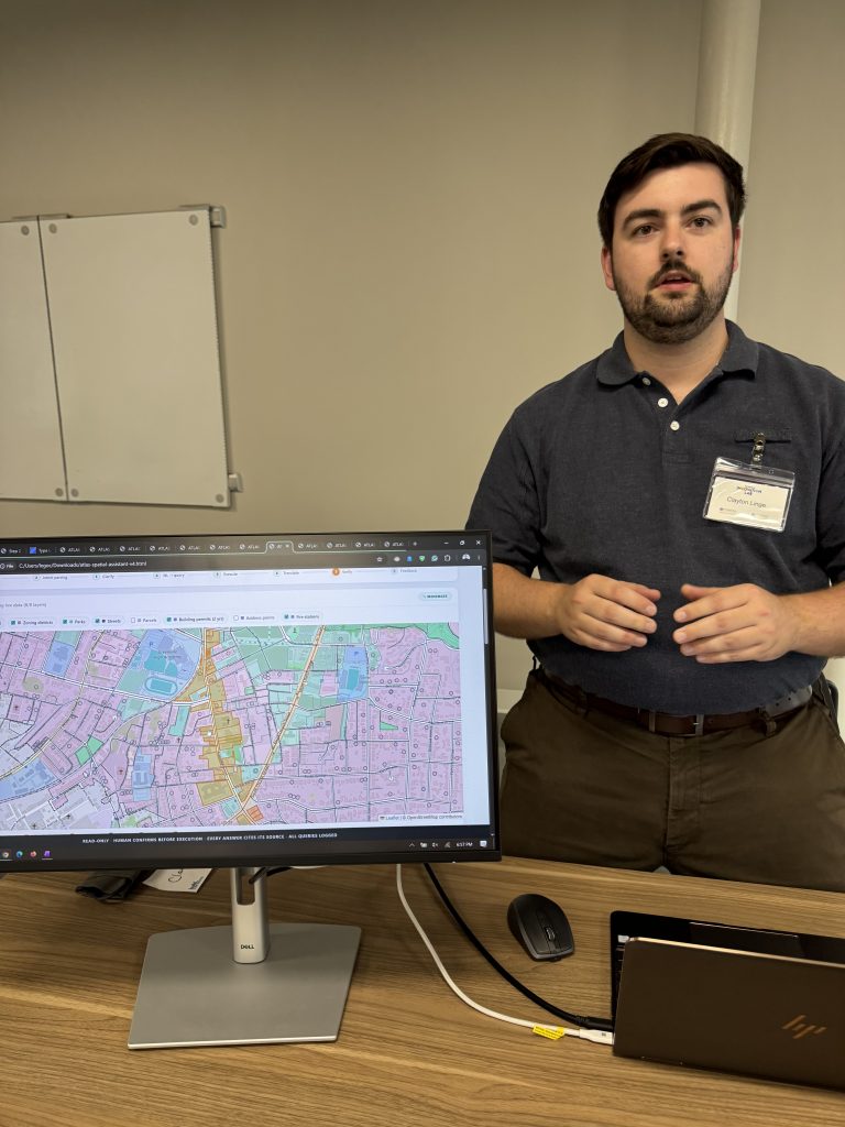 Furman students showing off AI projects at the Furman Innovation Lab at Flywheel Coworking
